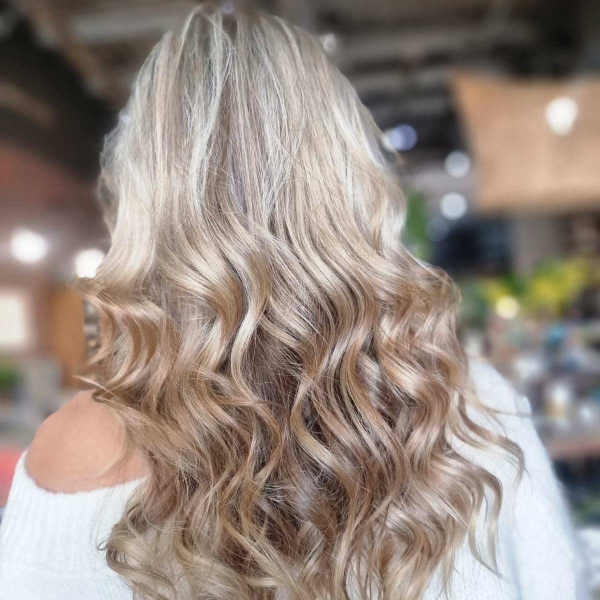 Cool silver blonde styled in soft waves