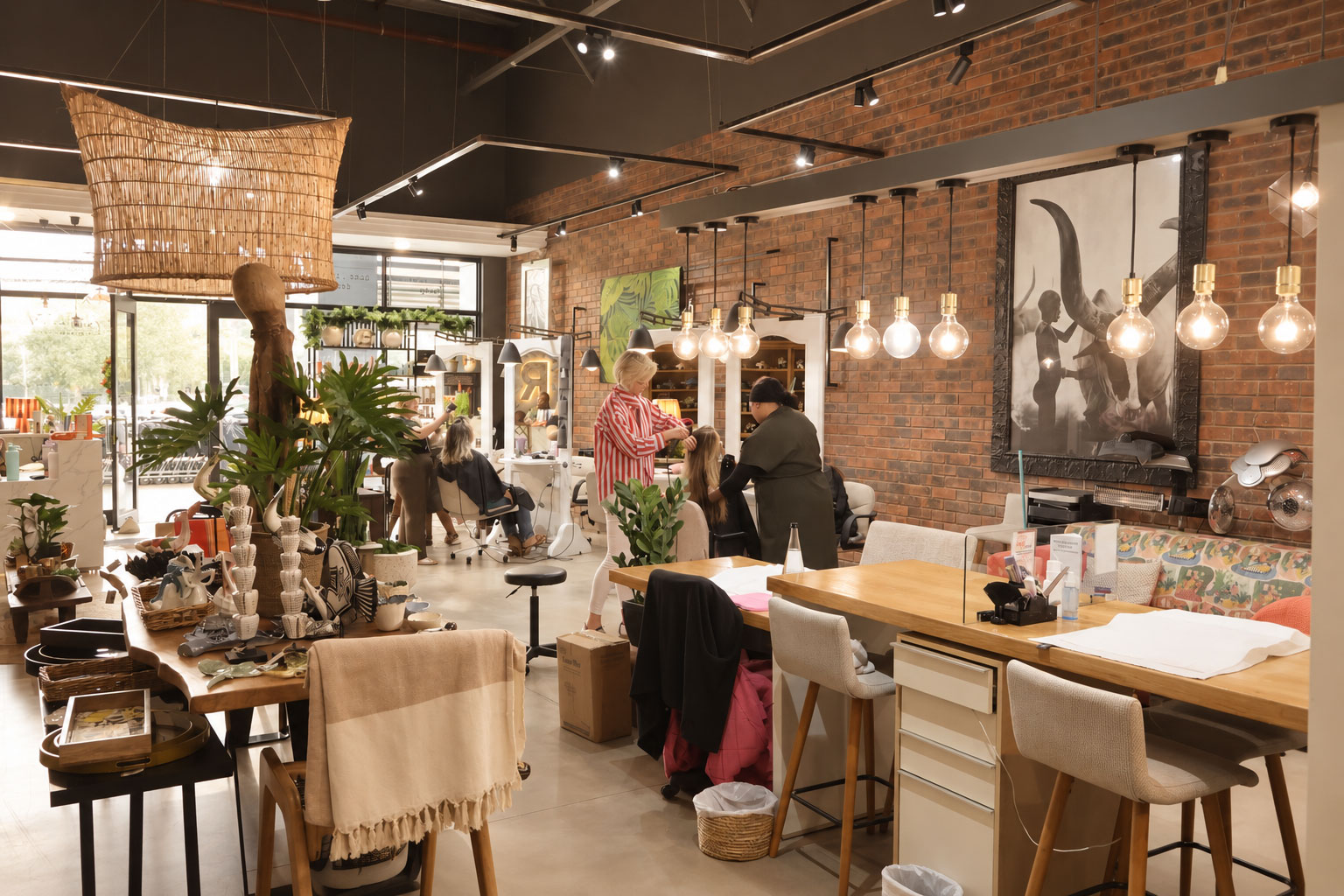 Inside the Kate Style salon — warm, open space with clients being styled